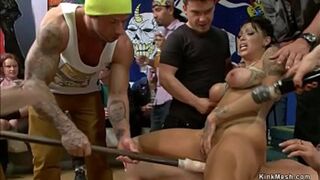 Rugged stud devours curvaceous tied siren's snatch amidst public mayhem.