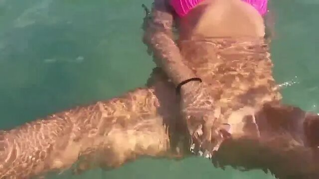 Busty solo girl in pink bikini teases and squirts