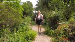 Big boobed lady in the open, no bra