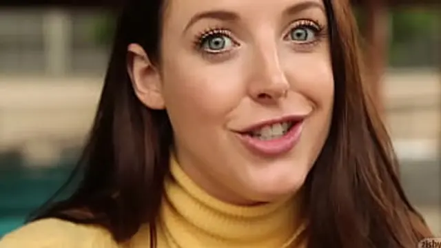 Angela White in a Yellow Sweater