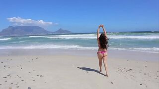 Exposed and playful under the sun at the shore
