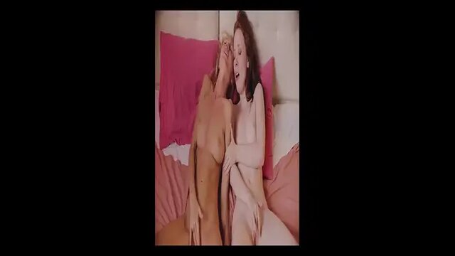 Two slutty babes lick and fuck each other's shaved pussy on the grass