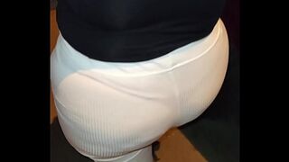 Mature woman wearing red thread in transparent leggings —  captured on the street
