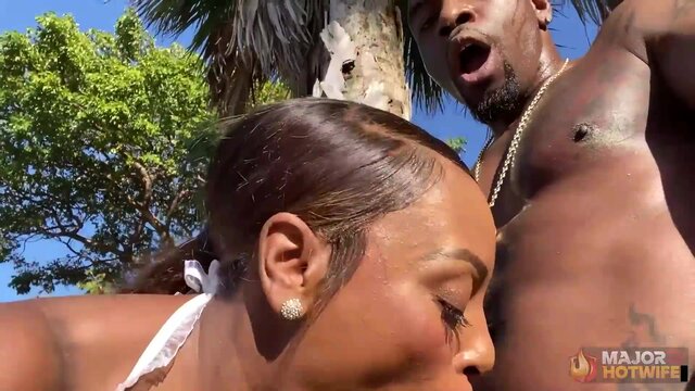 Hot brunette gets a BBC handjob and BJ at the beach