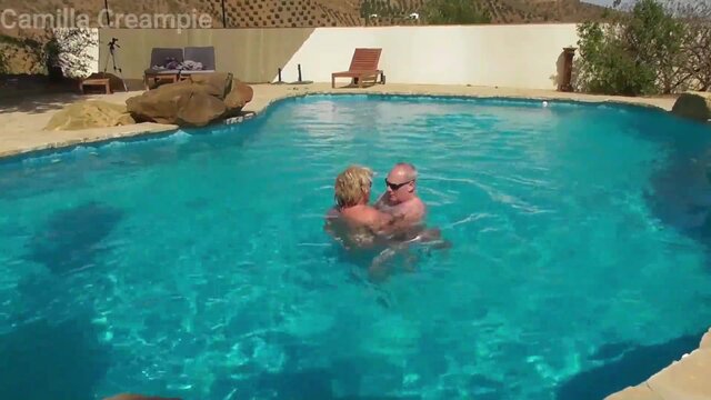 Mature babe blows hot and willing dick in the swimming pool on a sunny holiday