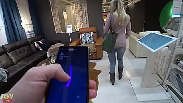 Girl enjoys turned on by vibrating panties while shopping in public